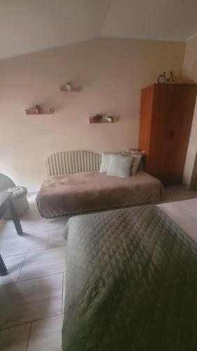 a hotel room with two beds in a room at Fabryka Słodkości Mielno - 2 in Mielno
