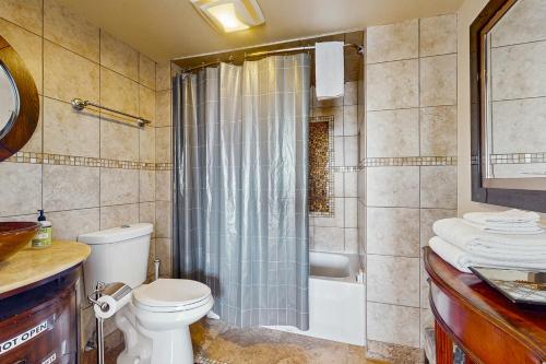a bathroom with a toilet and a shower at Newmark Tower in Seattle
