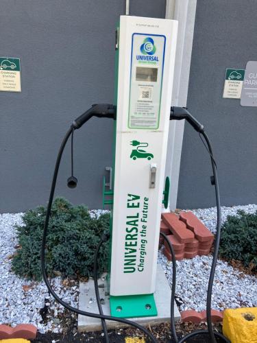 a gas station with a sign with a hose at Spark by Hilton Clarks Summit in Clarks Summit