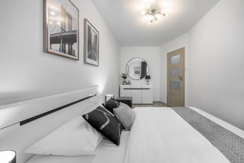 Katil atau katil-katil dalam bilik di Emihouse CityVibe Apartments