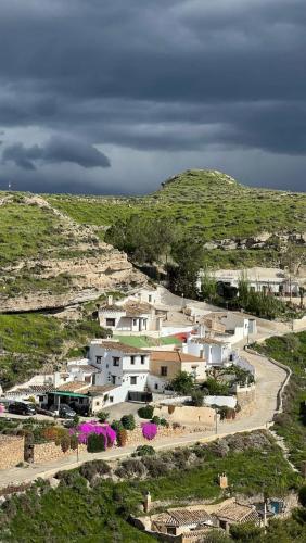 an aerial view of a village on a hill at La Petite Chaouen de Galera in Galera