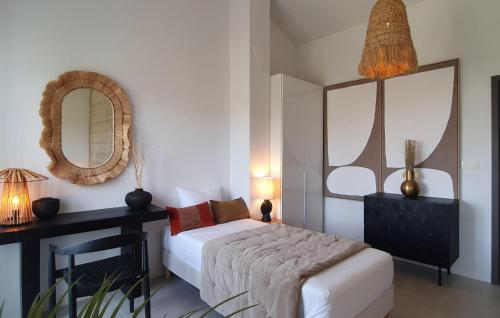 a bedroom with a bed and a mirror at 3 Bedroom Gorgeous Home In Klimno in Klimno