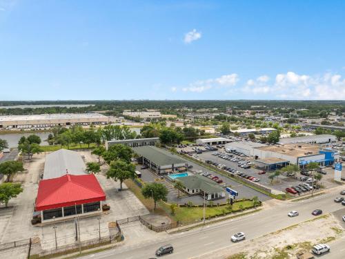 an aerial view of a town with a parking lot at Baymont by Wyndham Orlando Downtown in Orlando