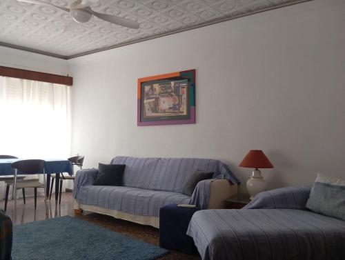 a living room with a couch and a table at Manzaneque Rural House in Caudete de las Fuentes