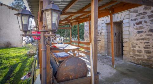 a building with a table and lights on it at chambres d hotes chateau d arcis in Les Granges