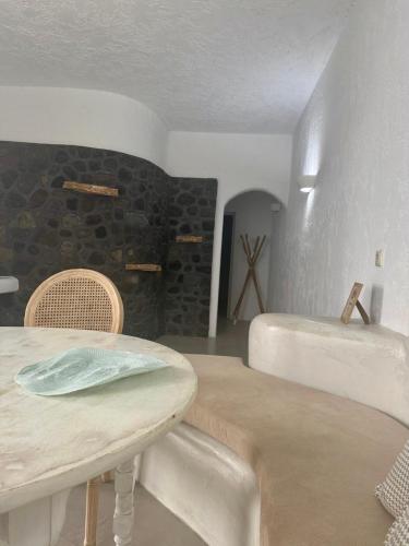 a room with a table and two beds in it at Sakas Residences in Karterados