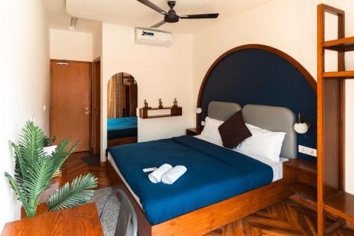 Ein Bett oder Betten in einem Zimmer der Unterkunft Joey's By The Ganges