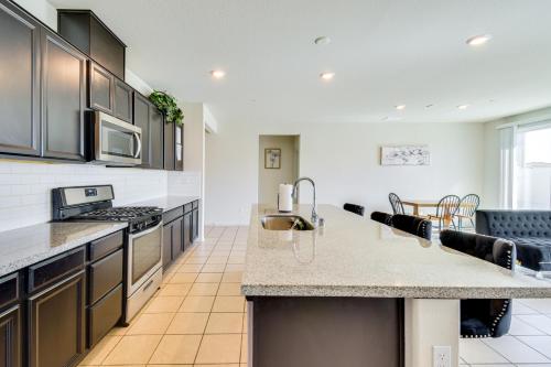 a kitchen with a sink and a counter top at WFH-Friendly Getaway with Yard in Manteca! in Manteca