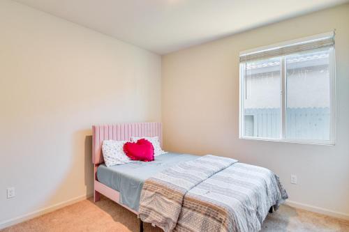 a bedroom with a bed and a window at WFH-Friendly Getaway with Yard in Manteca! in Manteca