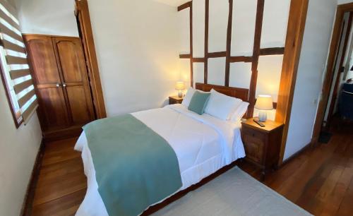 Postel nebo postele na pokoji v ubytování Cozy Place Hostal