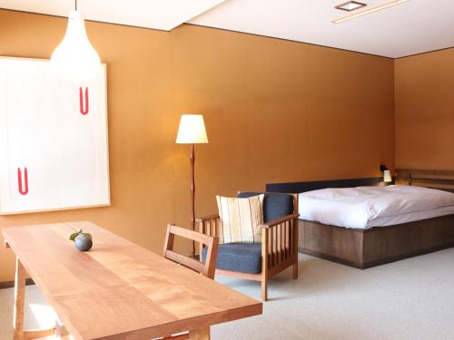 Ένα ή περισσότερα κρεβάτια σε δωμάτιο στο Itamuro Onsen Daikokuya