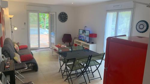a living room with a table and a couch at U citraghju in Feliceto