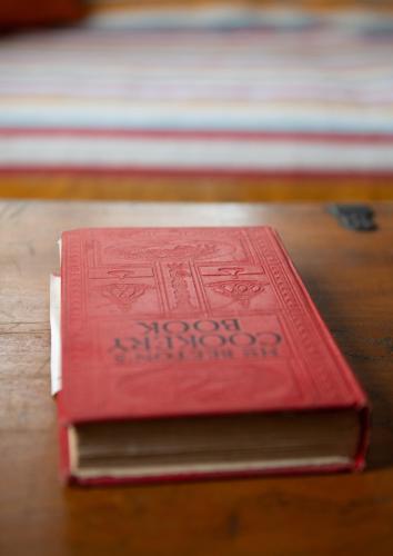 a stack of books sitting on a table at Il Casale Di Villa Rossi in Lucca