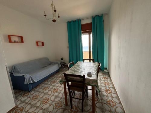 Ένα ή περισσότερα κρεβάτια σε δωμάτιο στο Appartamento Vista Mare