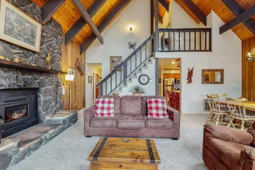 a living room with a couch and a fireplace at Tallac Views Getaway in South Lake Tahoe