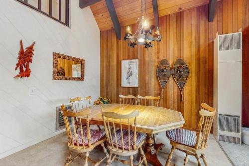 a dining room with a wooden table and chairs at Tallac Views Getaway in South Lake Tahoe