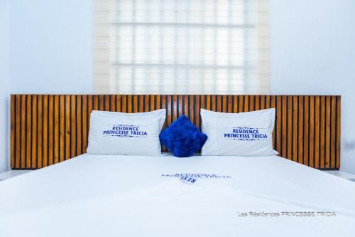 Ένα ή περισσότερα κρεβάτια σε δωμάτιο στο RESIDENCE PRINCESSE tricia
