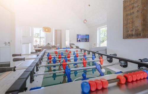a row of ping pong tables in a room at Amazing Home In Rømø With Wifi in Kongsmark