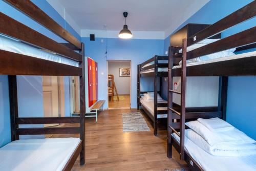 a room with four bunk beds and a hallway at 16eur - Old Town Munkenhof in Tallinn