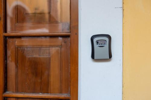 a door with a pay box on the side of it at Casa Araiza in Guadalajara