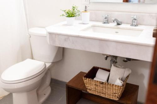 a bathroom with a toilet and a sink at Casa Araiza in Guadalajara