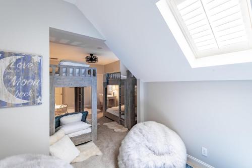 a room with bunk beds and a room with a window at 97 Jackstay Court by Akers Ellis Rentals in Kiawah Island