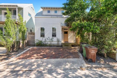 a white house with a driveway in front of it at Lincolnville Haven l Walk to DNTN l Dog Friendly in Saint Augustine