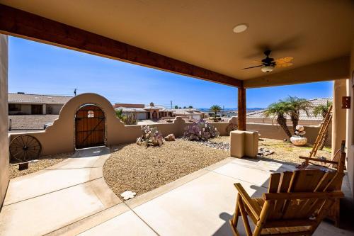 a house with a patio with a view of the desert at Havasu River Stay Pool Spa OutdoorTV Views in Lake Havasu City