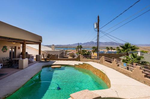 a swimming pool in the middle of a house at Havasu River Stay Pool Spa OutdoorTV Views in Lake Havasu City