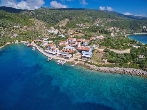 an aerial view of a small island with boats in the water at Restia House in Steni Vala Alonissos