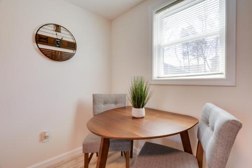 a dining room with a wooden table and chairs at 3 Mi to Main St and Beach Coastal Cape Cod Escape! in Wareham