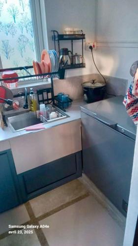 a kitchen with a sink and a counter top at Villasjohnclair in Eau Vanée