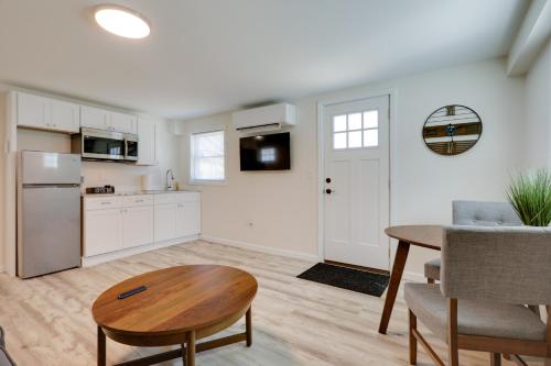 a kitchen and dining room with a table and a dining room gmaxwell gmaxwell at 3 Mi to Onset Beach Sleek Apartment in Wareham in Wareham