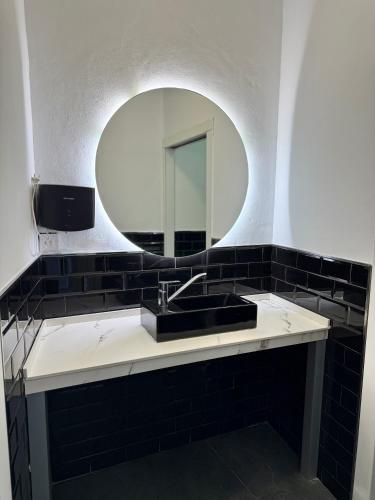a bathroom with a sink and a mirror at Villa Maréa in Algeciras