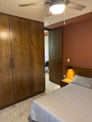 a bedroom with a bed and a ceiling fan at Dpto Laberinto 4 in Fresnillo de González Echeverría