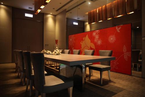 a dining room with a table and chairs at Hung's Mansion in Taichung