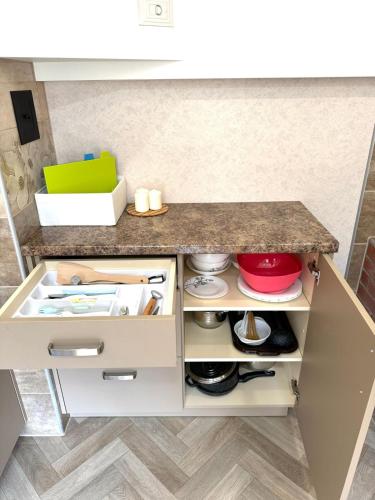 a kitchen with a counter with a counter top at Tūja apartment with private entrance and garden in Tūja