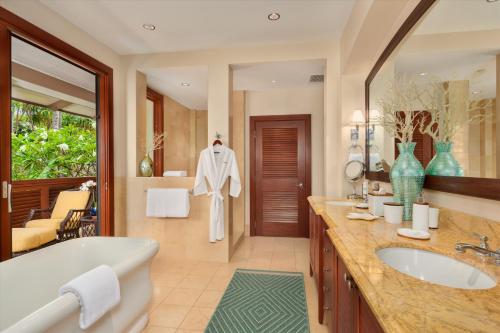 a bathroom with a tub and a sink at Ocean View Luxury, Castaway Cove C201, Wailea Beach Villas! in Wailea
