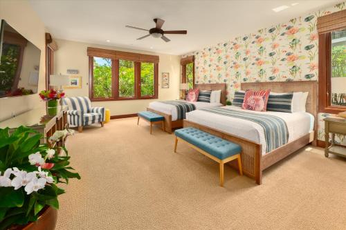 a bedroom with two beds and two chairs at Ocean View Luxury, Castaway Cove C201, Wailea Beach Villas! in Wailea