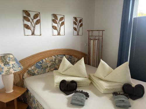 a bedroom with a bed with two pillows on it at Ferienwohnung mit Sauna -Marina Mücheln Geiseltalsee in Mücheln