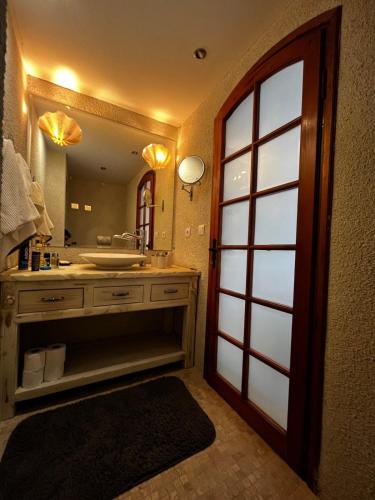 a bathroom with a sink and a large mirror at Castle81homes White , Sea view house in Marmaris