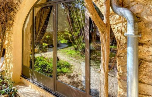 a window with a view of a garden at Gorgeous Home In Sabran in Sabran