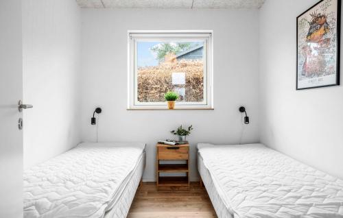 Ένα ή περισσότερα κρεβάτια σε δωμάτιο στο 4 Bedroom Awesome Home In Slagelse