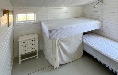 a small room with two bunk beds and a window at Beautiful Home In Grevinge With Wifi in Grevinge