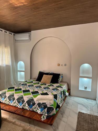 Postel nebo postele na pokoji v ubytování Tropical Suite Appart