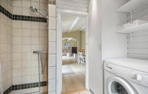 a laundry room with a washer and dryer at Awesome Home In Højby With Wifi in Højby