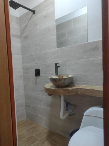 a bathroom with a sink and a toilet at HOTEL CASA RUSTICA Jr CALLAO 264 HUAMANGA AYACUCHO in Ayacucho