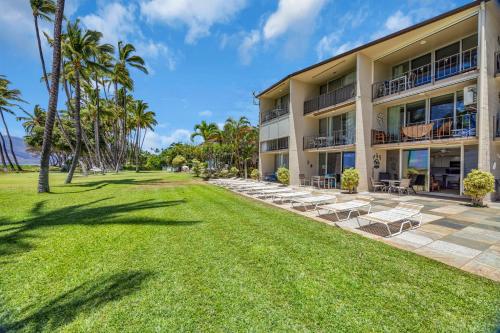 aominium building with lounge chairs and the ocean at Hale Kai O'Kihei 118 in Kihei