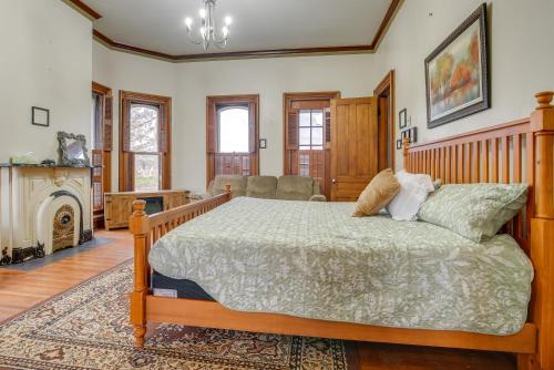 a bedroom with a large bed and a fireplace at Family Home Near Franklin Historic District in Franklin