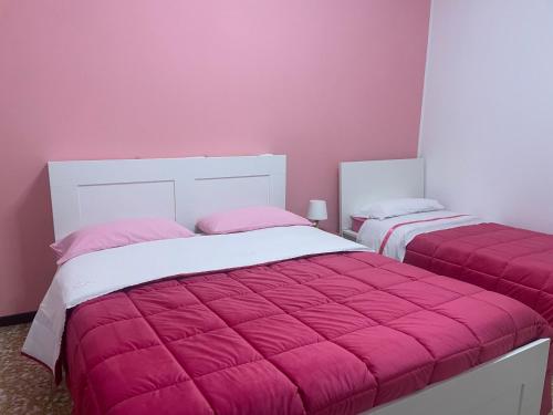 Postel nebo postele na pokoji v ubytování aeroporto room1